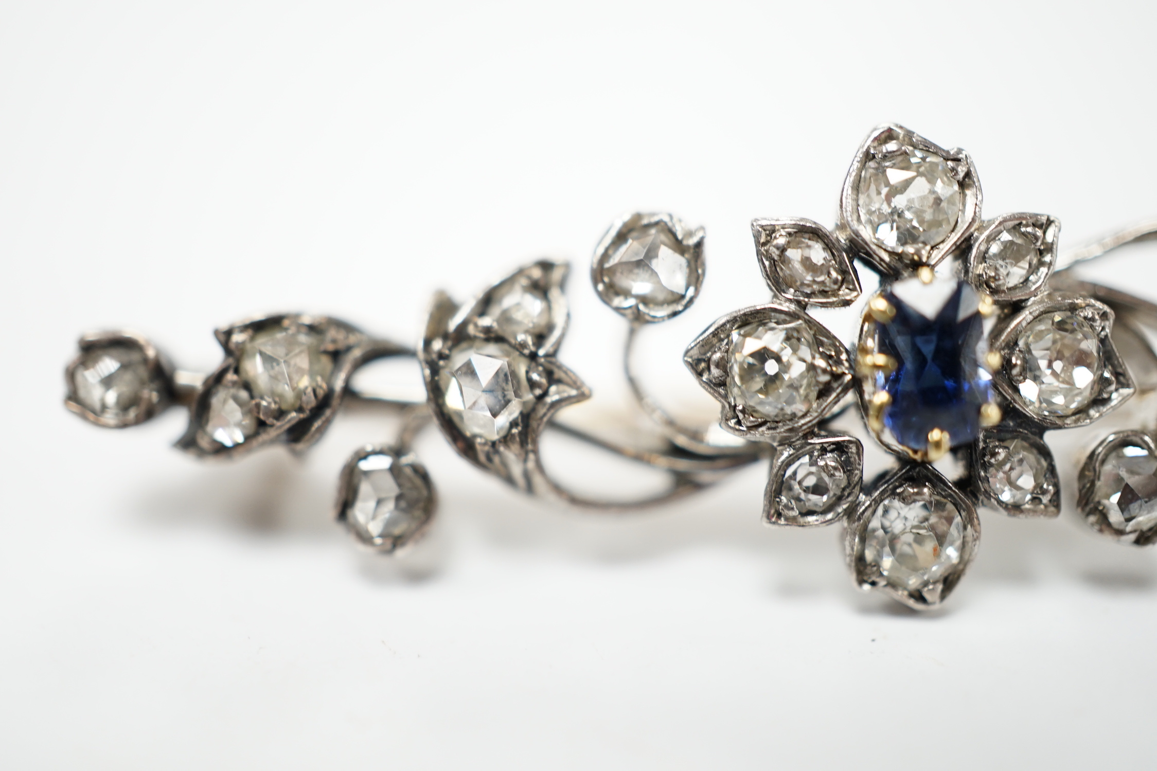 A late Victorian yellow and white metal, sapphire, old and rose cut diamond cluster set foliate brooch, 47mm, gross weight 4.3 grams.